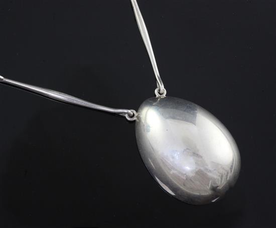 An Astrid Fog for Georg Jensen sterling silver egg shaped pendant necklace, no. 122, pendant 52mm.